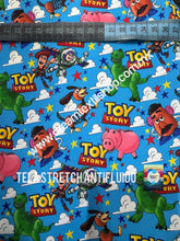 Cargar imagen en el visor de la galería, Microfibra Stretch Antifluidos Toy Story fondo turquesa

