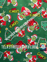 Cargar imagen en el visor de la galería, Microfibra Stretch Antifluidos Grinch xmas fondo verde

