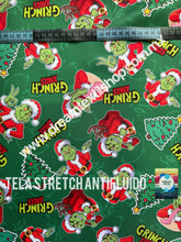 Cargar imagen en el visor de la galería, Microfibra Stretch Antifluidos Grinch xmas fondo verde
